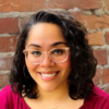 A women with glasses on smiling