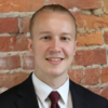 A man in suit smiling