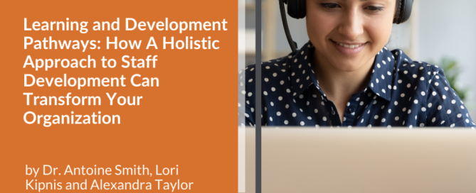Woman working on her computer with headphones on