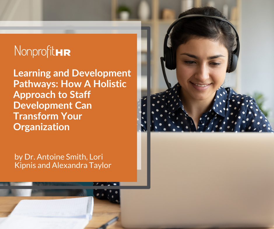 Woman working on her computer with headphones on