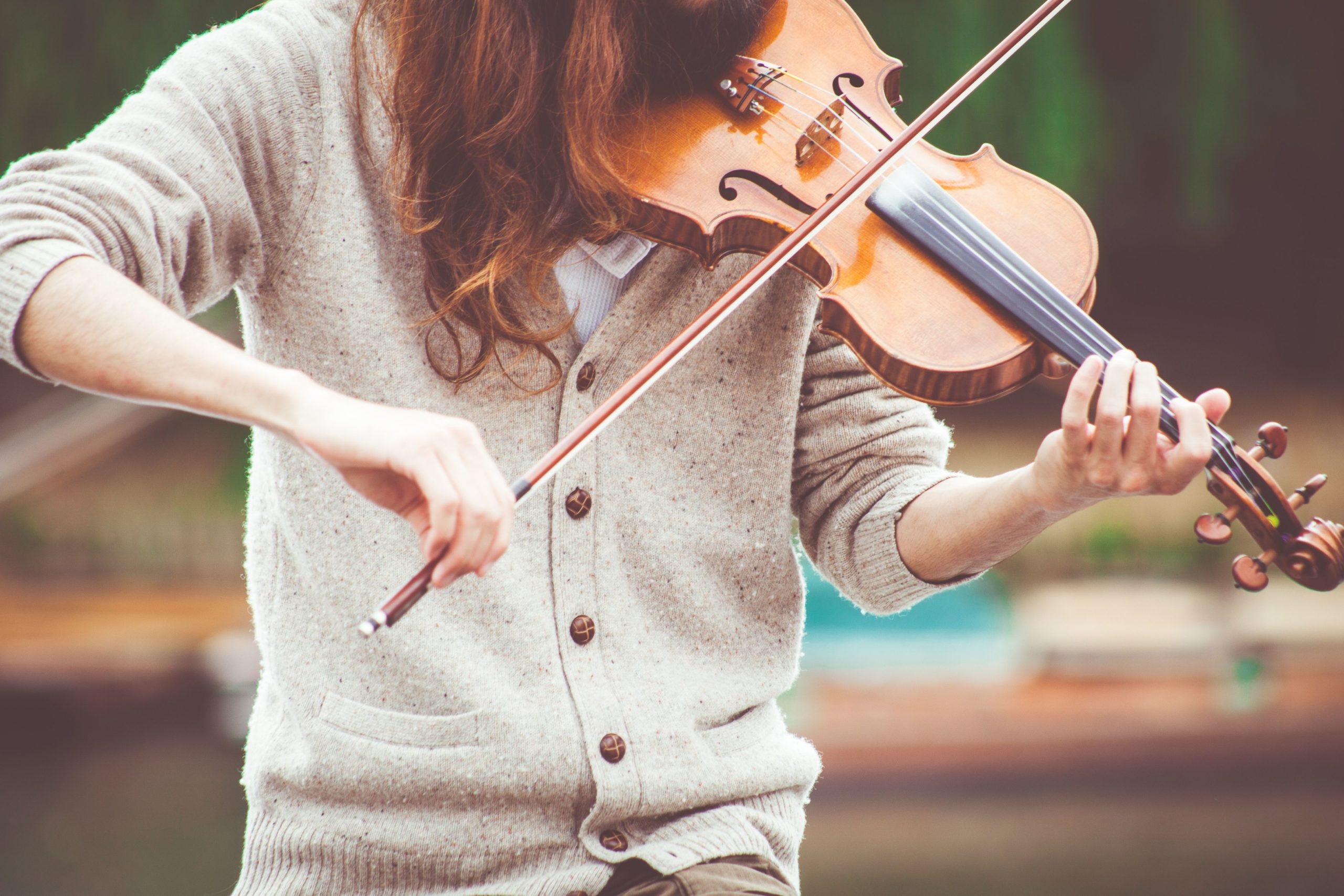 Image of a woman playing a violin