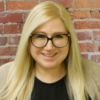 Girl smiling with glasses on